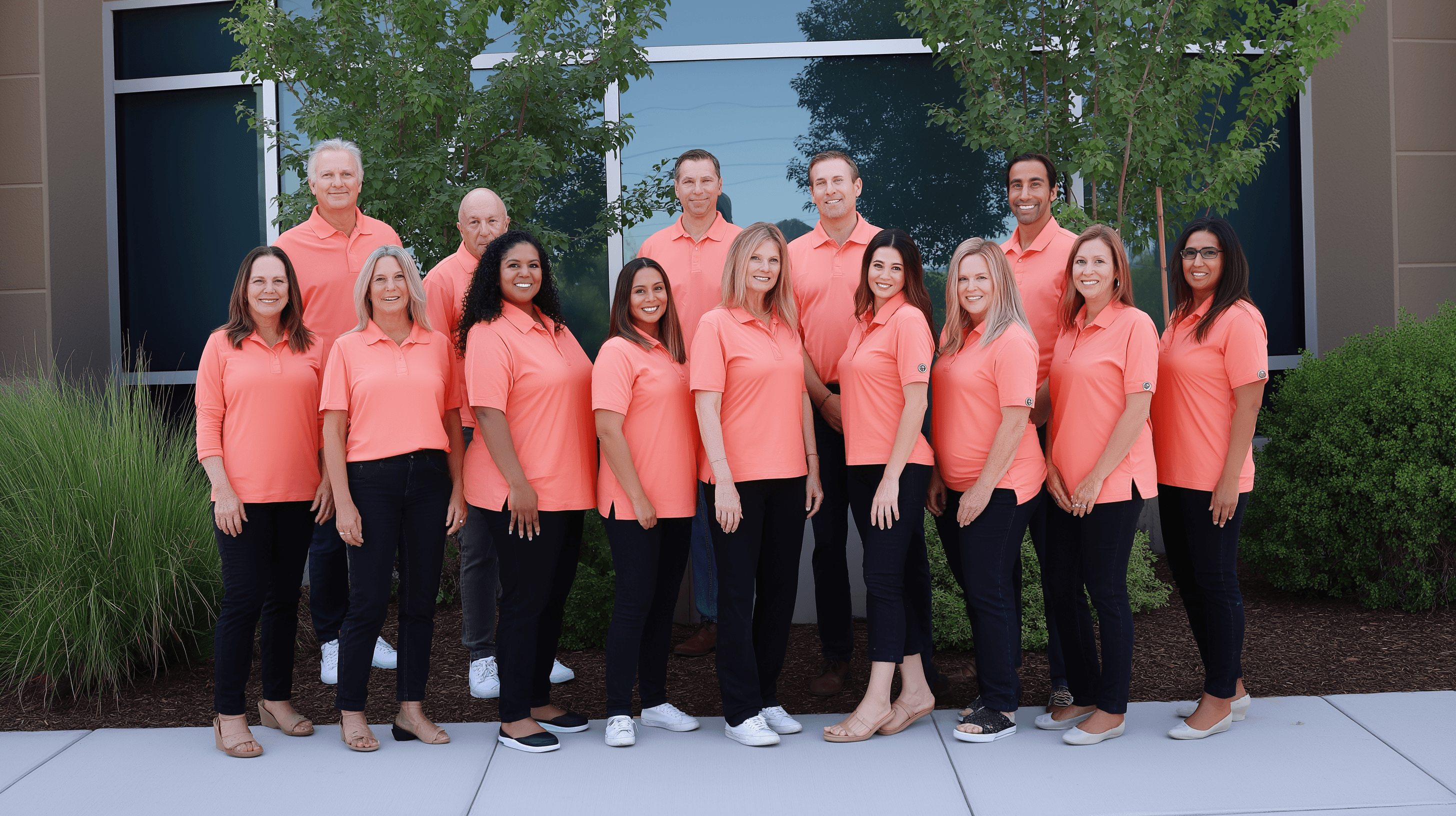 Staff group photo near company office